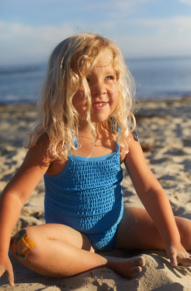 Girls scrunch one piece swimsuit in bright blue. Sizes 3 months to 10 years old. 